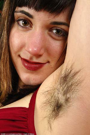 woman with hairy armpits wearing red top